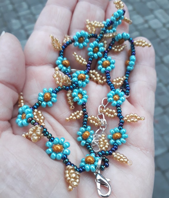 Pandahall Tutorial on How to Make a Beaded Flower Pendant Necklace | Beaded  bracelets diy, Beaded bracelet patterns, Beaded jewelry patterns