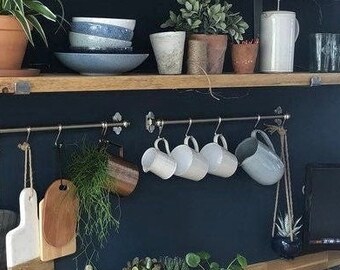 Industrial style rustic wood shelf and steel scaffolding board supports