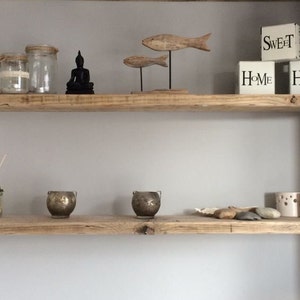 Floating wooden wall shelves with invisible fixings