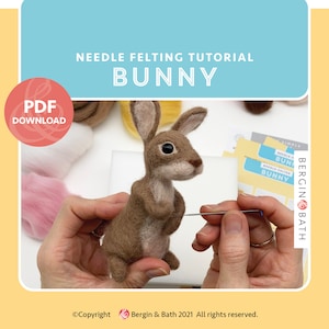 May include: A needle felting tutorial for making a brown bunny. The image shows a person's hands holding a needle and felting a brown bunny. The bunny is standing upright with its ears perked up. The image also includes a close-up of the bunny's face, which has brown eyes and a pink nose. The text "Needle Felting Tutorial Bunny" is at the top of the image.