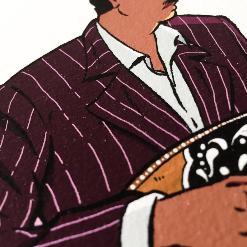 May include: A close-up of a man wearing a pinstripe suit jacket with a white shirt underneath. The jacket is a dark burgundy color with thin pink stripes. The man is holding a musical instrument in his hands.