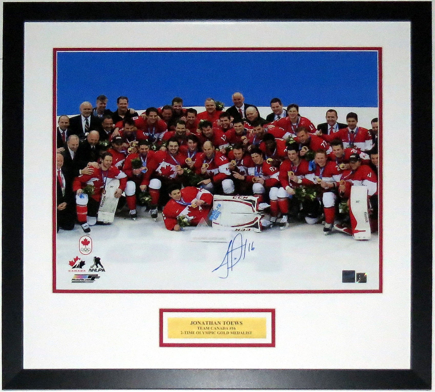 Jonathan Toews Autographed and Framed White Blackhawks Jersey