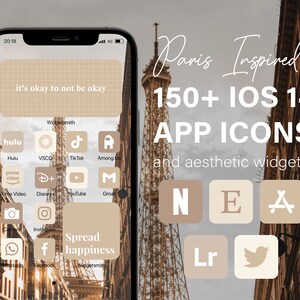 May include: A screenshot of an iPhone with a Paris-themed aesthetic app icon pack. The icons are in a beige color scheme and feature a variety of popular apps, including Hulu, Instagram, and YouTube. The text "Paris Inspired 150+ IOS 14 APP ICONS and aesthetic widgets" is displayed at the top of the screen.