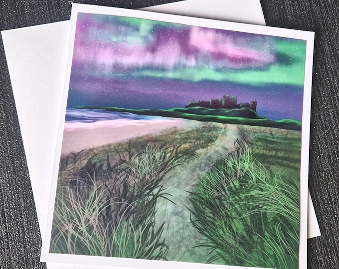 Featured listing image: Northern Lights Bamburgh Castle Card | Northumberland Art Print