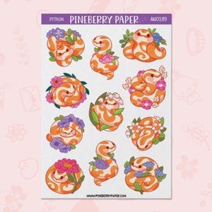 May include: A sheet of stickers featuring orange and white cartoon snakes with floral accents. The stickers have various poses and are surrounded by flowers in shades of pink, purple, and blue. The text "PYTHON" and "PINEBERRY PAPER" are at the top.