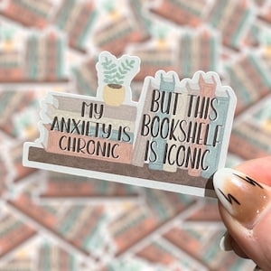 May include: A sticker with a bookshelf illustration and the text "My anxiety is chronic, but this bookshelf is iconic."