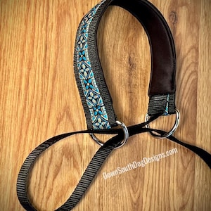 May include: Black dog leash with a padded handle featuring a decorative blue and white geometric pattern. The leash has two silver metal rings and a black nylon strap. The text "DownSouthDogDesigns.com" is visible.