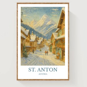 May include: Watercolor print of St. Anton, Austria, depicting a snow-covered village nestled in a valley with towering mountains in the background. The artwork features a street scene with buildings and figures, framed in a wooden border.