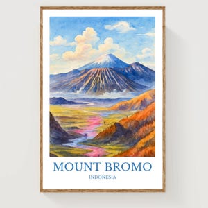 May include: Watercolor painting of Mount Bromo in Indonesia, framed in a wooden frame. The artwork depicts a vibrant landscape with a blue sky, fluffy clouds, and a majestic volcano. The text "MOUNT BROMO" and "INDONESIA" are at the bottom.