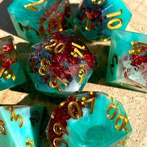 Pyrotechnics II -Cosmic Swirled Green/White/Glittering Red 7 Piece Sharp Edge Dice Set- Ruby Color Flake Inclusions- Pathfinder, DnD, TTRPGs