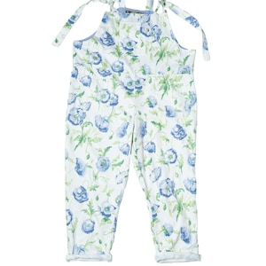 May include: White overall with a blue floral pattern. The overalls have adjustable straps that tie at the shoulders and cuffed hems. The floral design features blue flowers and green leaves.