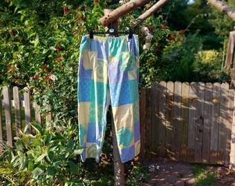 Stretch waist ladies trousers size 20. Yellow, purple and green pattern. Reworked textiles.