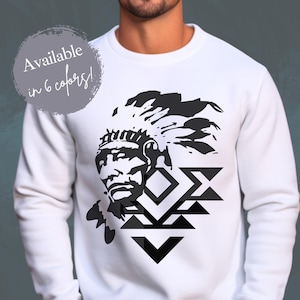 May include: White sweatshirt with a black and white graphic of a Native American chief wearing a headdress. The graphic is centered on the front of the sweatshirt. The text "Available in 6 colors!" is in a gray box in the top left corner of the image.