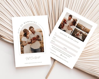 May include: Two white gift certificates with photographs of a family. One certificate reads "Gift of Memories" and "Gift Certificate". The other reads "Gifted with Love" and has space for details. The background is a beige, dried palm leaf.