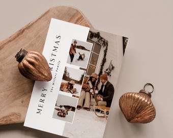 May include: A Christmas card with family photos and the words "MERRY CHRISTMAS" printed on it. Two copper-colored, decorative ornaments sit near the card on a wooden tray. The card features a family enjoying winter activities.