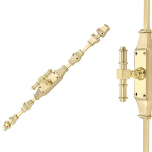 May include: A set of brass window hardware, featuring a long, articulated arm and a rectangular plate with a handle. The hardware has a polished finish, designed for window operation. The design is ornate and classic.