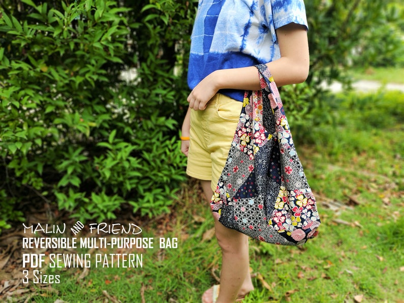 May include: A reversible multi-purpose bag with a patchwork design, featuring floral and geometric patterns in various colors. The bag is held by a person. Text on the image reads: "MALIN AND FRIEND REVERSIBLE MULTI-PURPOSE BAG PDF SEWING PATTERN 3 Sizes."