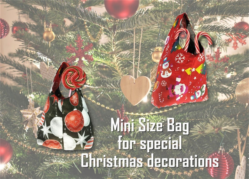 May include: Two mini Christmas-themed bags. One is black with red and white ornaments, the other is red with snowmen and Santa Claus. Both bags have handles and are filled with candy canes and a lollipop. Text reads "Mini Size Bag for special Christmas decorations."