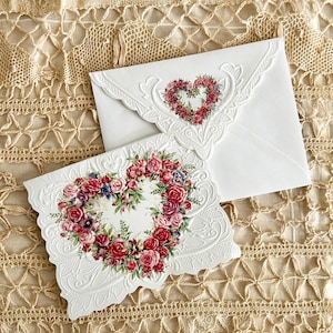 May include: A handmade, wooden cutting board with a natural finish. The board features a live edge on one side and a smooth, rectangular shape. It is approximately 18 inches long and 12 inches wide.