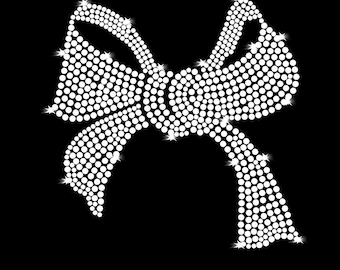 May include: A white rhinestone bow with a large center loop and two smaller loops on either side. The bow is made of small, round rhinestones that are arranged in a pattern to create the shape of the bow.