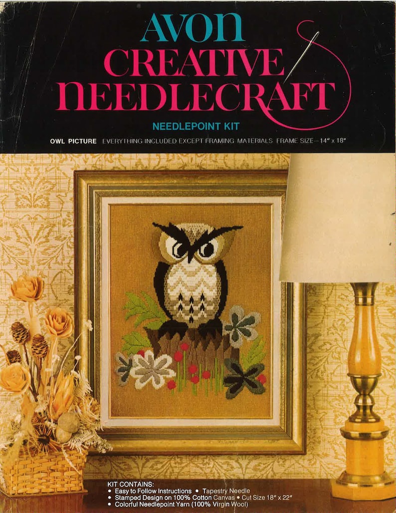 May include: An Avon Creative Needlecraft needlepoint kit featuring an owl picture. The framed artwork displays a detailed owl design with a brown, black, and white color scheme, set against a tan background. The kit includes instructions, a tapestry needle, and colorful yarn.