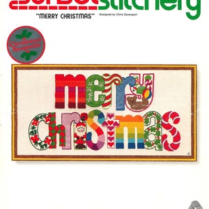 May include: A cross-stitch kit featuring a colorful "Merry Christmas" design. The kit includes 100% wool yarn, a needle, and instructions. The kit is designed for a 10" x 20" frame.