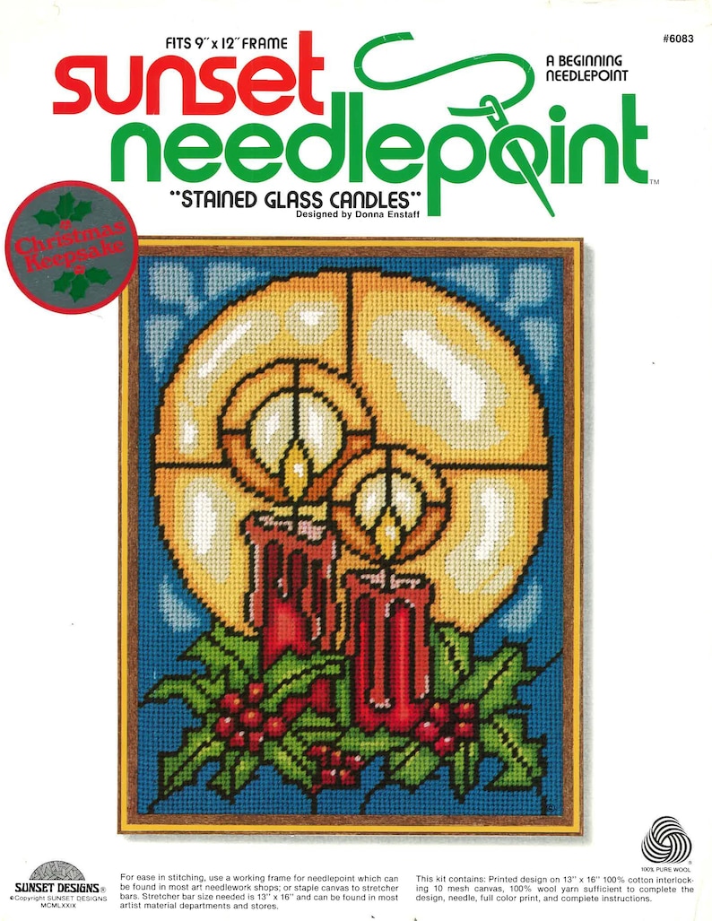 May include: Needlepoint kit titled "Stained Glass Candles" featuring a design of two red candles with flames and holly berries. The kit includes 100% wool yarn, a needle, and instructions. It fits a 9 x 12 inch frame.