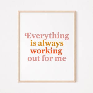 Può includere: Una stampa incorniciata con il testo "Everything is always working out for me" in lettere rosa, arancio e giallo su uno sfondo bianco.
