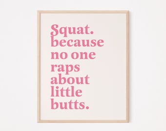 Könnte beinhalten: Ein gerahmter Druck mit einem rosafarbenen Motivationszitat, das lautet: "Squat. because no one raps about little butts."