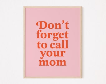 May include: A pink framed print with the text "Don't forget to call your mom" in orange.