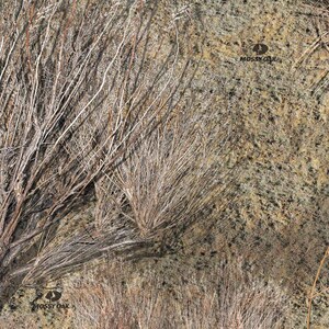 May include: A camouflage pattern featuring a brown, tan, and beige background with a variety of brown, tan, and beige branches and twigs. The pattern is repeated throughout the image. The text "Mossy Oak" is visible in the image.