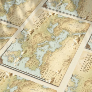 May include: A set of five vintage-style maps of the Roman Empire, each with a beige background and blue water features. The maps are printed on thick paper and have a distressed, aged look. The text on the maps reads "Roman Empire in the Year 15 AD" and "Legend".