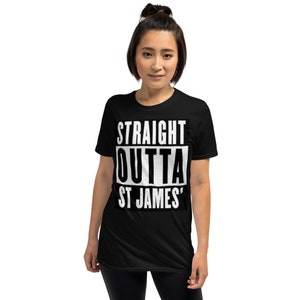 May include: Black t-shirt with the text "STRAIGHT OUTTA ST JAMES'" in a bold, white, rectangular design. The shirt is a short-sleeved, crew neck style.