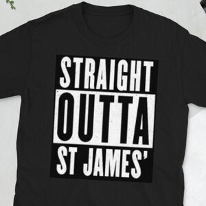 May include: Black t-shirt with the text "STRAIGHT OUTTA ST JAMES" in a bold, white, rectangular design. The shirt is made of a soft material and has a crew neck.