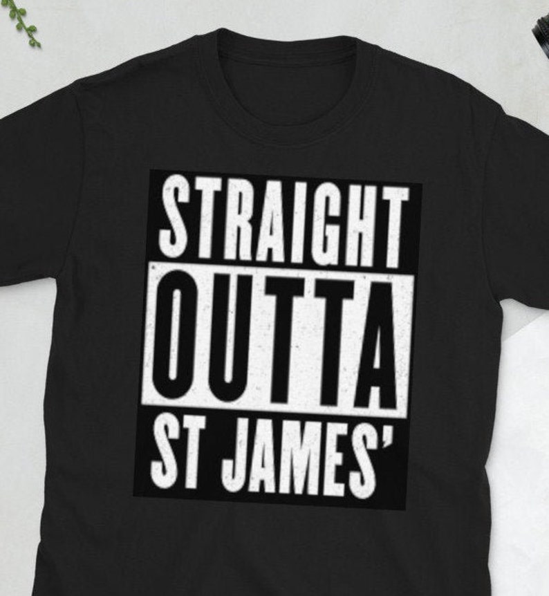 May include: Black t-shirt with the text "STRAIGHT OUTTA ST JAMES" in a bold, white, rectangular design. The shirt is made of a soft material and has a crew neck.