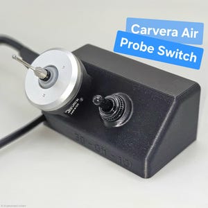 May include: A black Carvera Air Probe Switch with a silver and black rotary component and a toggle switch. The device has a 3D-OFF-1D marking and is connected to a black cable. The text "Carvera Air Probe Switch" is displayed in blue.