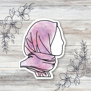 May include: A pink and purple watercolour illustration of a woman wearing a headscarf. The illustration is outlined in black and has a white background.