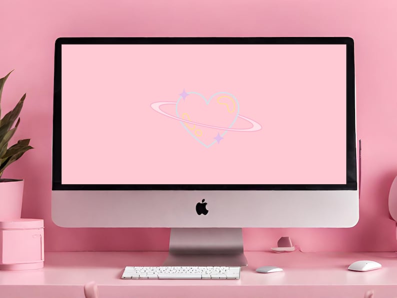 Puede incluir: Un ordenador de sobremesa rosa con un fondo rosa en la pantalla. El fondo presenta un coraz&oacute;n azul claro con un anillo amarillo a su alrededor, como un planeta. Hay peque&ntilde;as estrellas alrededor del coraz&oacute;n.