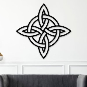 May include: A black Celtic knot wall art piece. The design features an intricate, symmetrical pattern of interwoven lines, creating a visually striking and symbolic piece. The artwork is mounted on a white wall, adding a touch of elegance to any space.