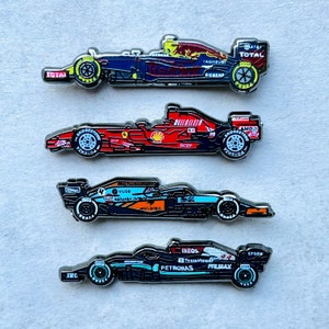 Formula 1 Enamel Pins: Mercedes, Red Bull, McLaren, Ferrari.