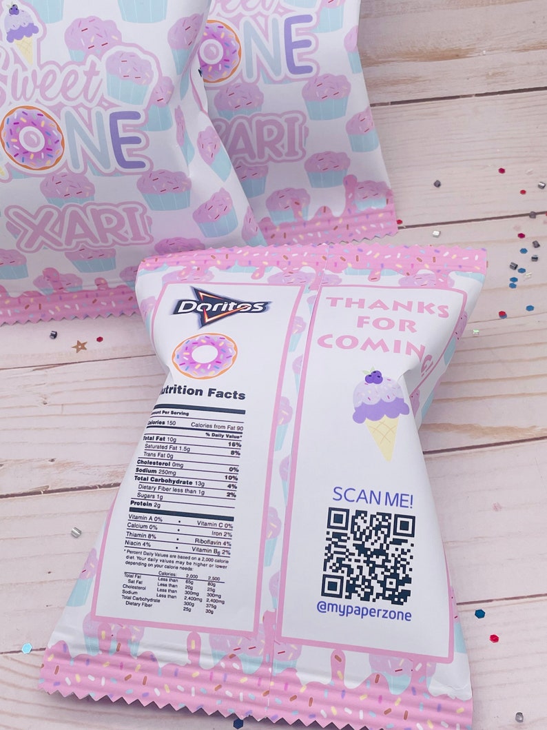 May include: A pink and white party favor bag with a donut and cupcake design. The bag is filled with Doritos chips and has a nutrition facts label on the side. The back of the bag has a QR code and the text "Thanks for coming" and "@mypaperzone".