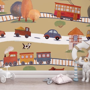 May include: A colourful illustration depicting a train, cars, and houses on a tan background. A cat, a dog, and a toy car are in the foreground. The image has a playful, childlike aesthetic, suitable for nursery decor.