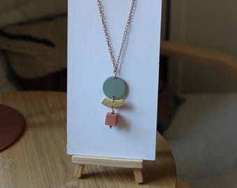 Elleboro necklace with round pendant in cardboard, brass crescent and concrete cube. Geometric necklace. Laser cut necklace.
