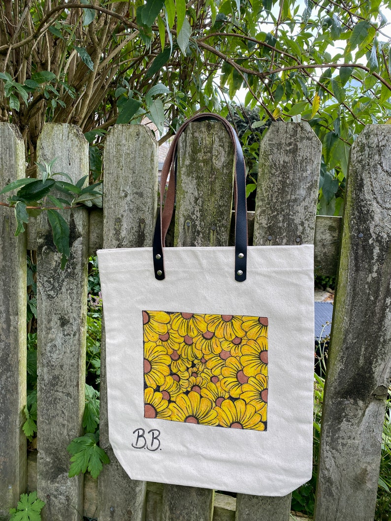 Beautiful hand drawn individually designed leather handle high quality canvas bag.