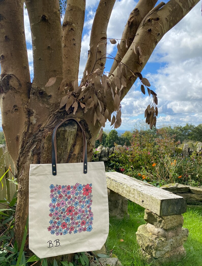 Beautiful hand drawn individually designed leather handle high quality canvas bag.