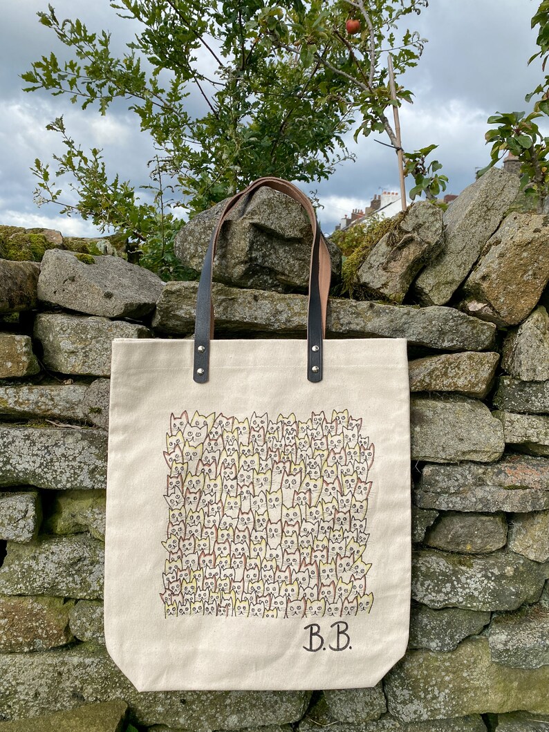 Beautiful hand drawn individually designed leather handle high quality canvas bag.