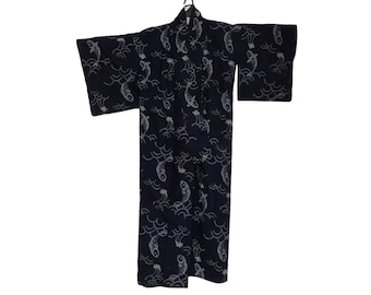 May include: A dark blue kimono with a repeating pattern of white koi carp and waves. The traditional Japanese garment is hanging on a black hanger against a white background. The kimono has wide sleeves and a loose fit.