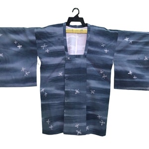 May include: A dark blue Japanese kimono with a white dragonfly pattern. The kimono has a traditional design and is made of a soft, comfortable fabric.