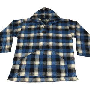 May include: A blue, black, and white plaid hooded pullover with a front pocket. The long-sleeved shirt has a button closure at the neckline. The fabric appears to be a thick, warm material.