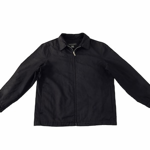 May include: A black jacket with a collared neckline and a full-length zipper closure. The jacket has long sleeves with buttoned cuffs. The garment is displayed against a white background.